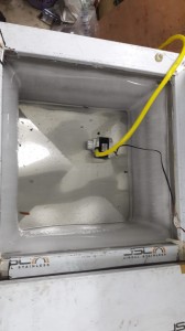 Stainless steel defreezer inner shell with thermostat wiring before coil bonding