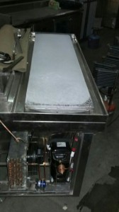 Top of a defreezer cabinet with ice formation showing efficient cooling