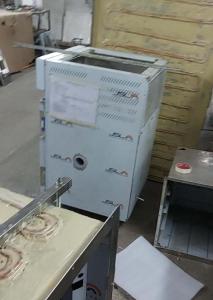 Defreezer cabinets on the workshop floor next to a tawa ice-cream machine
