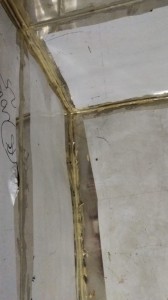 Close-up of paste bead along the inside corner of a milk cooler tank